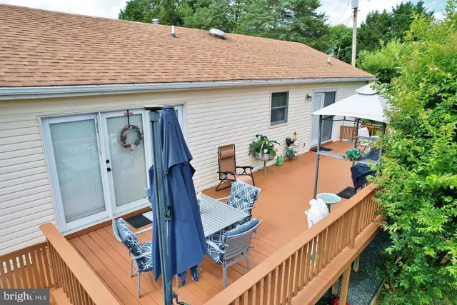 a bathroom with a sink a toilet and shower curtain