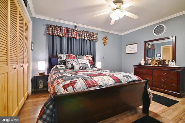 a patio with table and chairs and potted plants