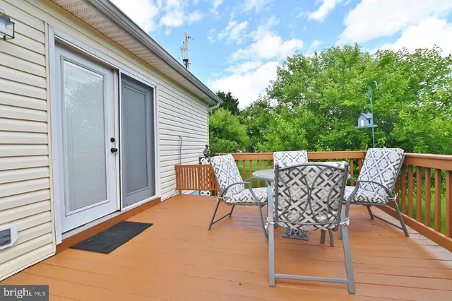 a view of a patio with wooden floor