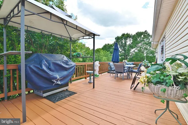 a view of a chairs and table on the wooden floor
