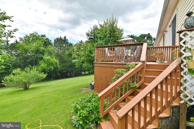 a view of a deck with a backyard