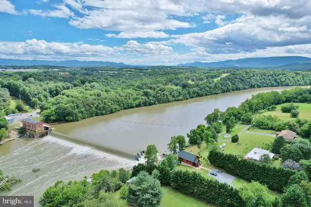 an aerial view of a houses with outdoor space