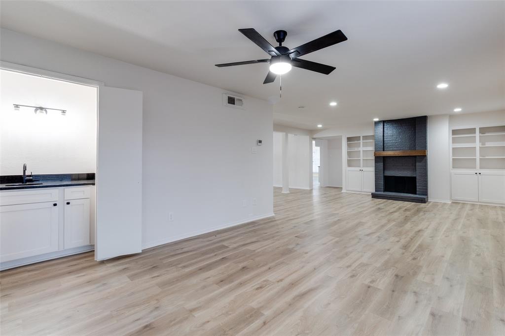 10530 Stone Canyon Road, Unit 208 Dallas, TX 75230 - Photo 17 of 24 an empty room with cabinet and stainless steel appliances