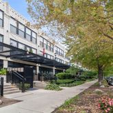 a view of a building with a yard