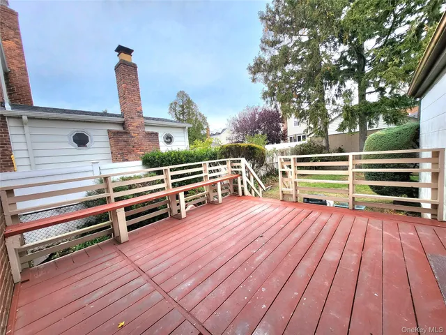 a view of outdoor space with deck and flat screen tv