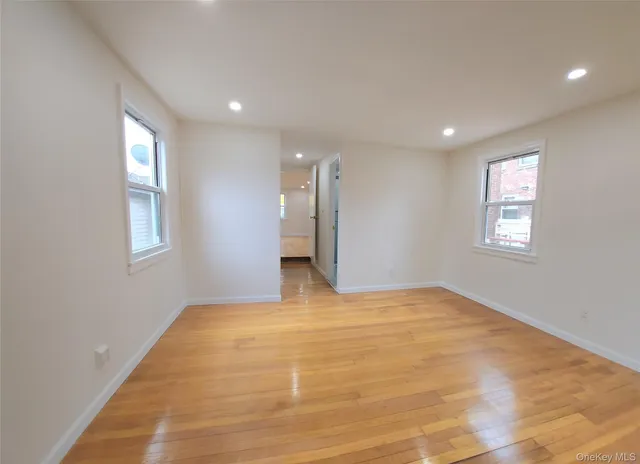a view of an empty room with windows