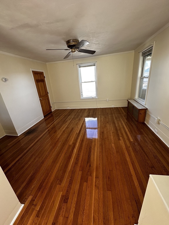 a view of an empty room and wooden floor