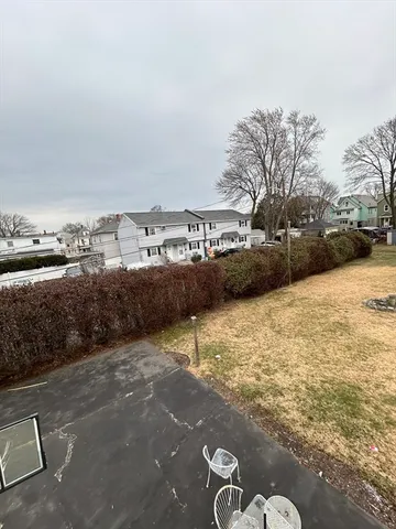 a view of swimming pool with a yard