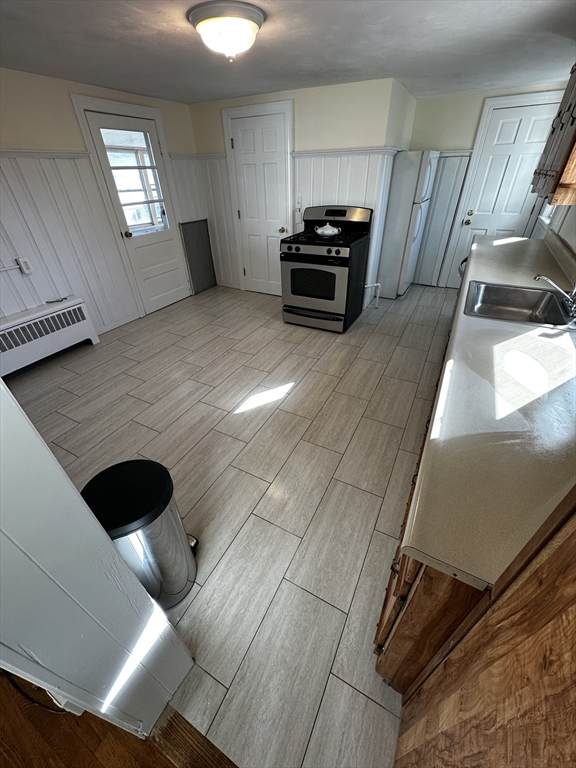 45 Highland Avenue, Unit 2 Everett, MA 02149 - Photo 3 of 9 a view of kitchen with furniture and window