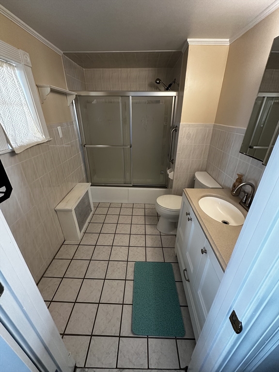 45 Highland Avenue, Unit 2 Everett, MA 02149 - Photo 7 of 9 a bathroom with a sink and a toilet