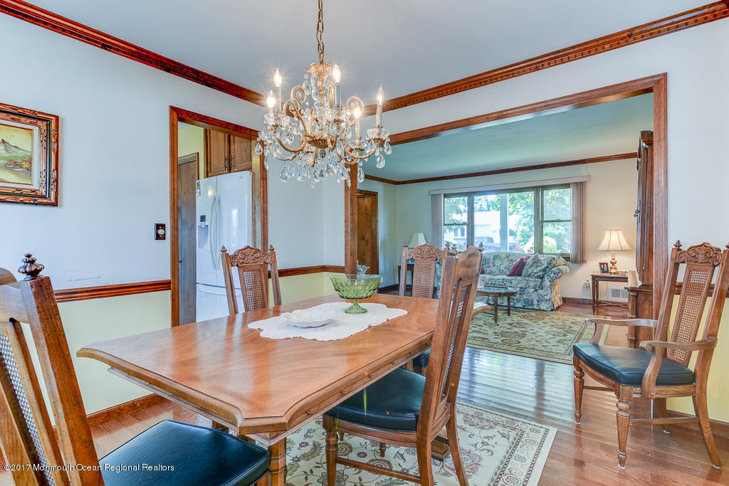 173 Club House Road Brick, NJ 08723 - Photo 14 of 30 a view of a dining room with furniture a chandelier and wooden floor