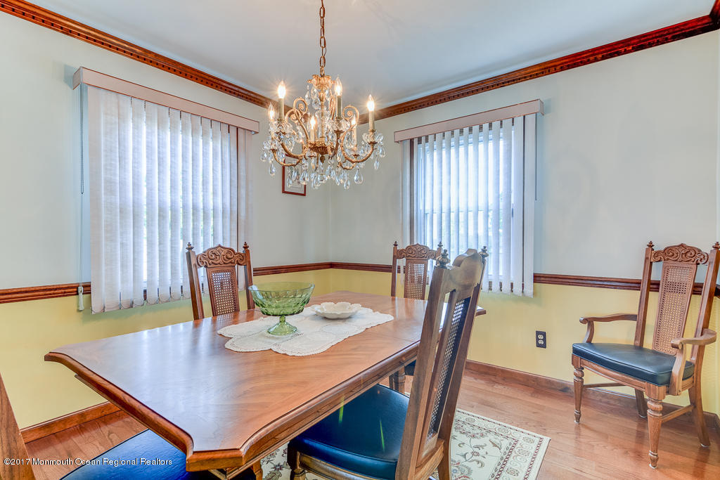 173 Club House Road Brick, NJ 08723 - Photo 15 of 30 a view of a dining room with furniture and chandelier
