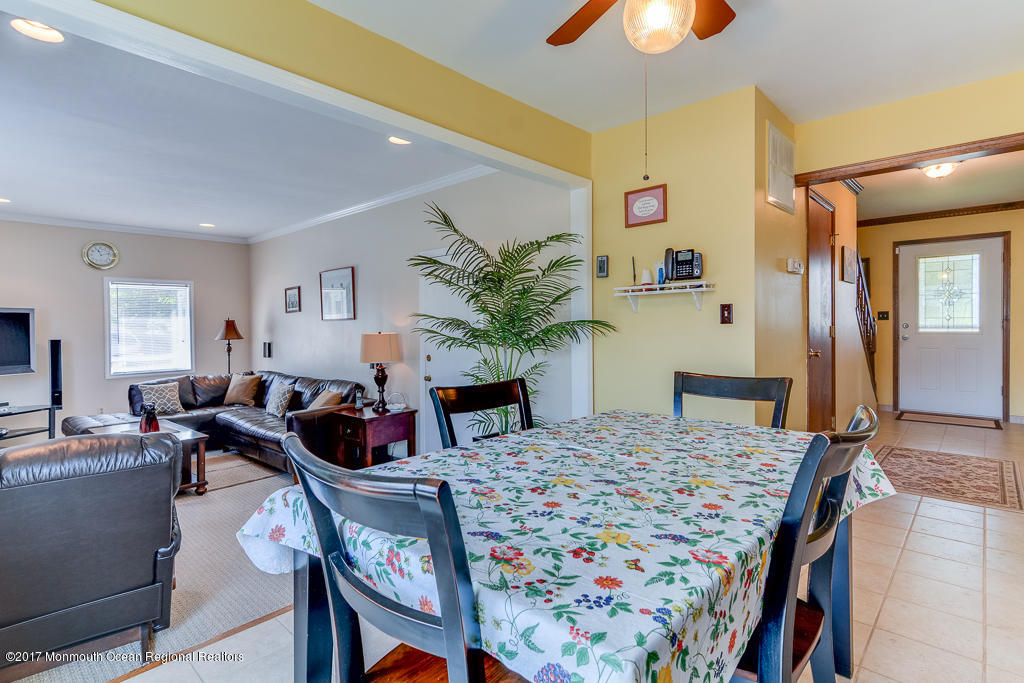173 Club House Road Brick, NJ 08723 - Photo 21 of 30 a living room with furniture and a chandelier