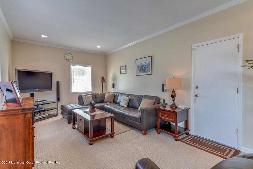 173 Club House Road Brick, NJ 08723 - Photo 23 of 30 a living room with furniture and a flat screen tv