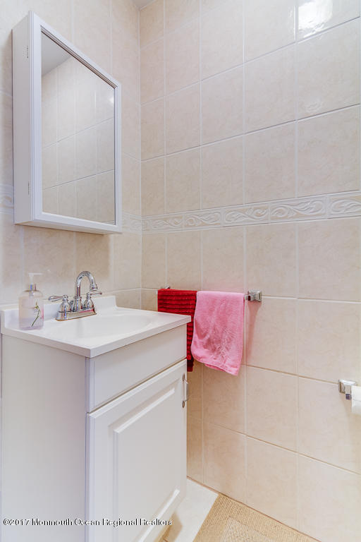 173 Club House Road Brick, NJ 08723 - Photo 25 of 30 a bathroom with a sink and a mirror
