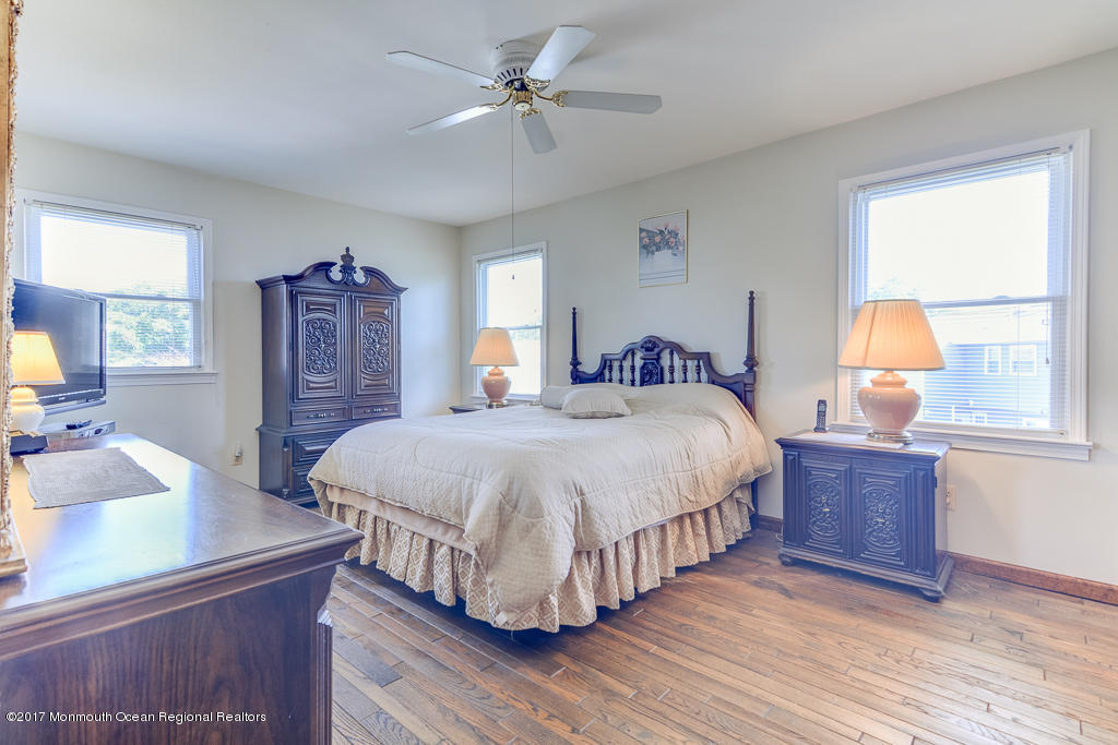 173 Club House Road Brick, NJ 08723 - Photo 26 of 30 a spacious bedroom with a bed and wooden floor