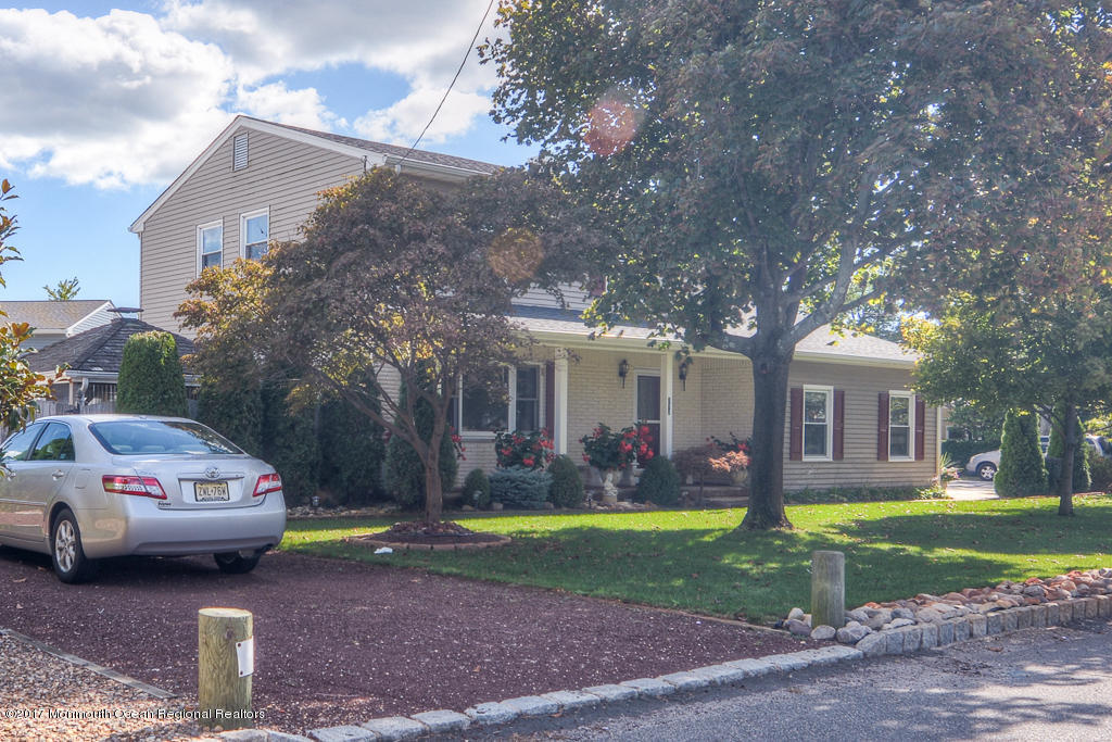 173 Club House Road Brick, NJ 08723 - Photo 3 of 30 a view of a car parked in front of a house