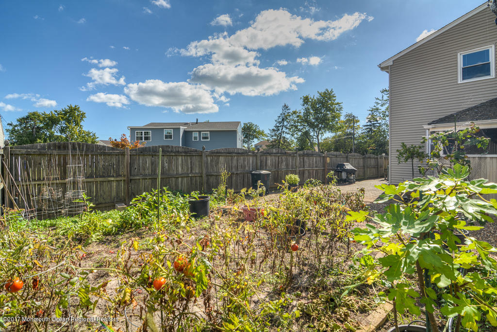 173 Club House Road Brick, NJ 08723 - Photo 8 of 30 a view of a backyard with a garden