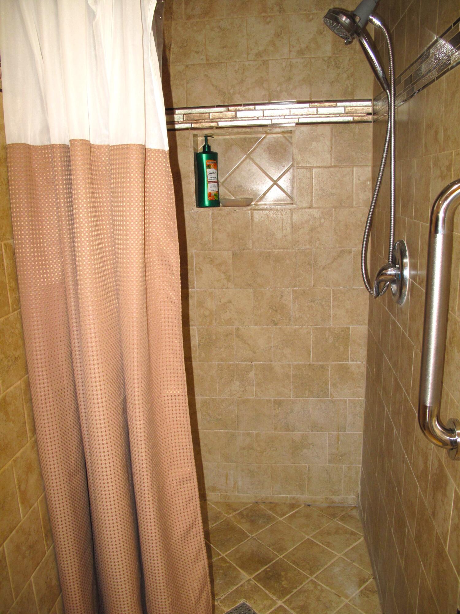 5145 Northwest 3rd Street, Unit B Delray Beach, FL 33445 - Photo 22 of 54 Full guest bathroom with shower stall