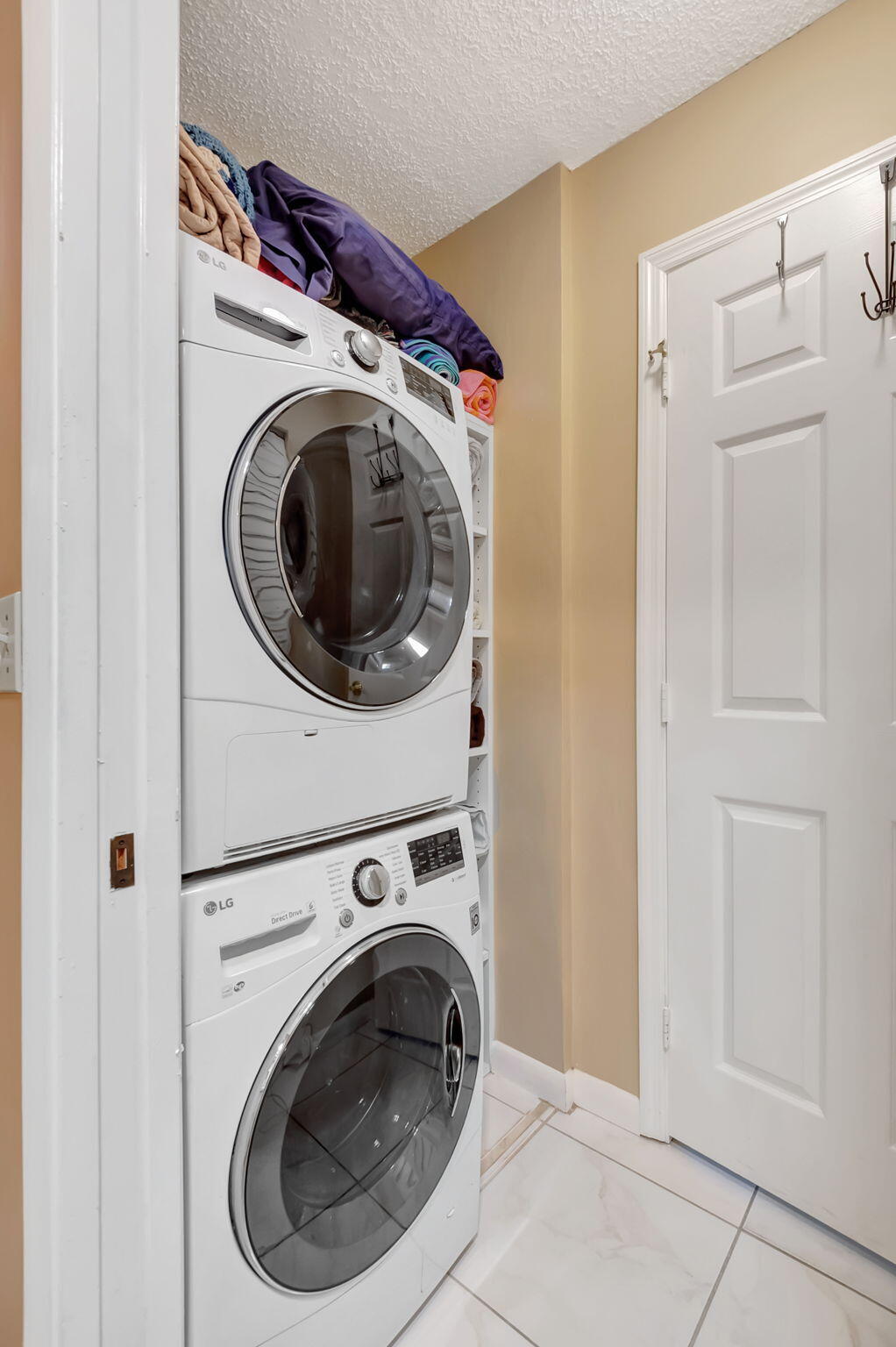 5145 Northwest 3rd Street, Unit B Delray Beach, FL 33445 - Photo 27 of 54 Full size washer and dyer inside villa