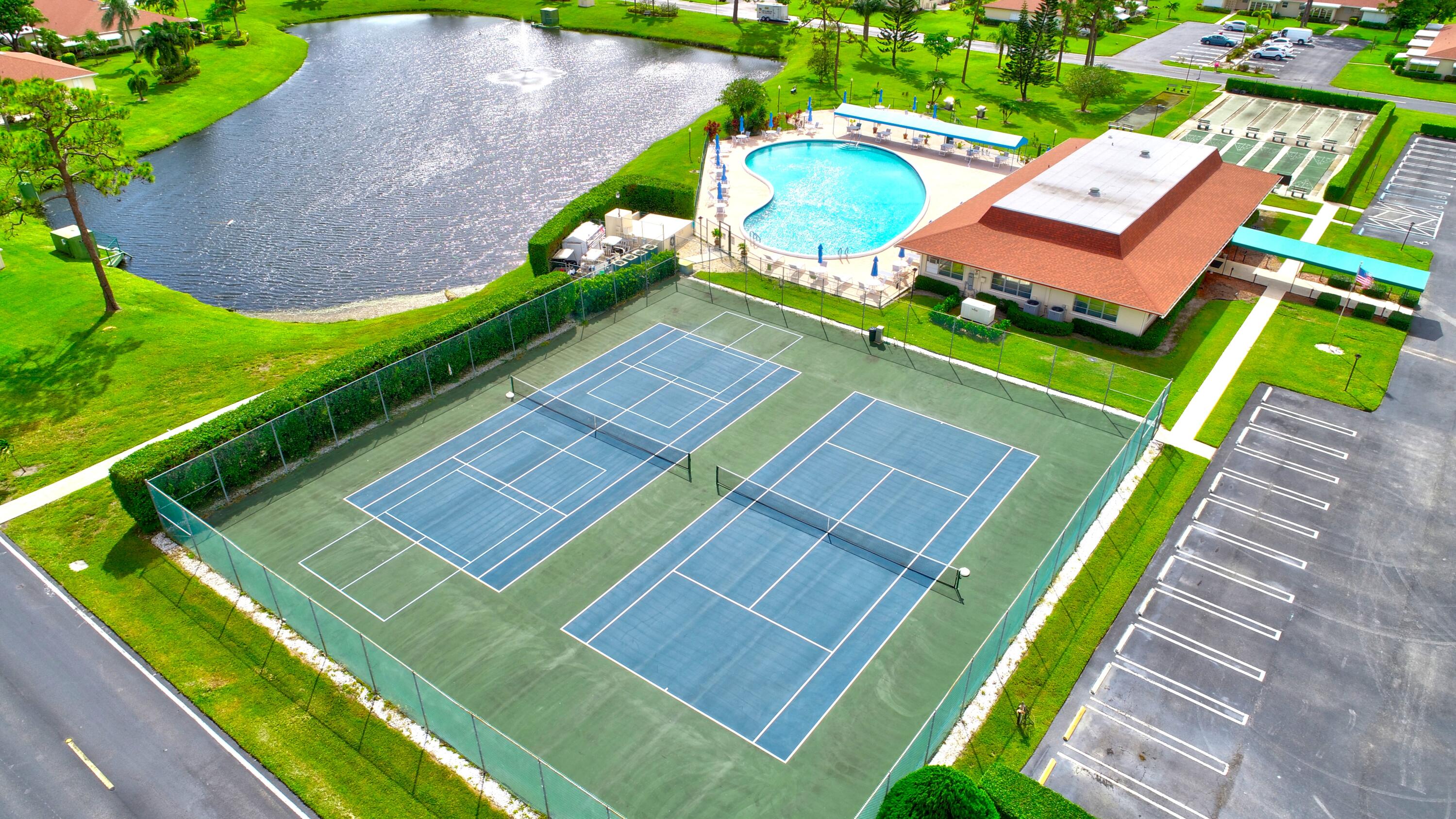5145 Northwest 3rd Street, Unit B Delray Beach, FL 33445 - Photo 42 of 54 HP7 Tennis and areial view of the amenit