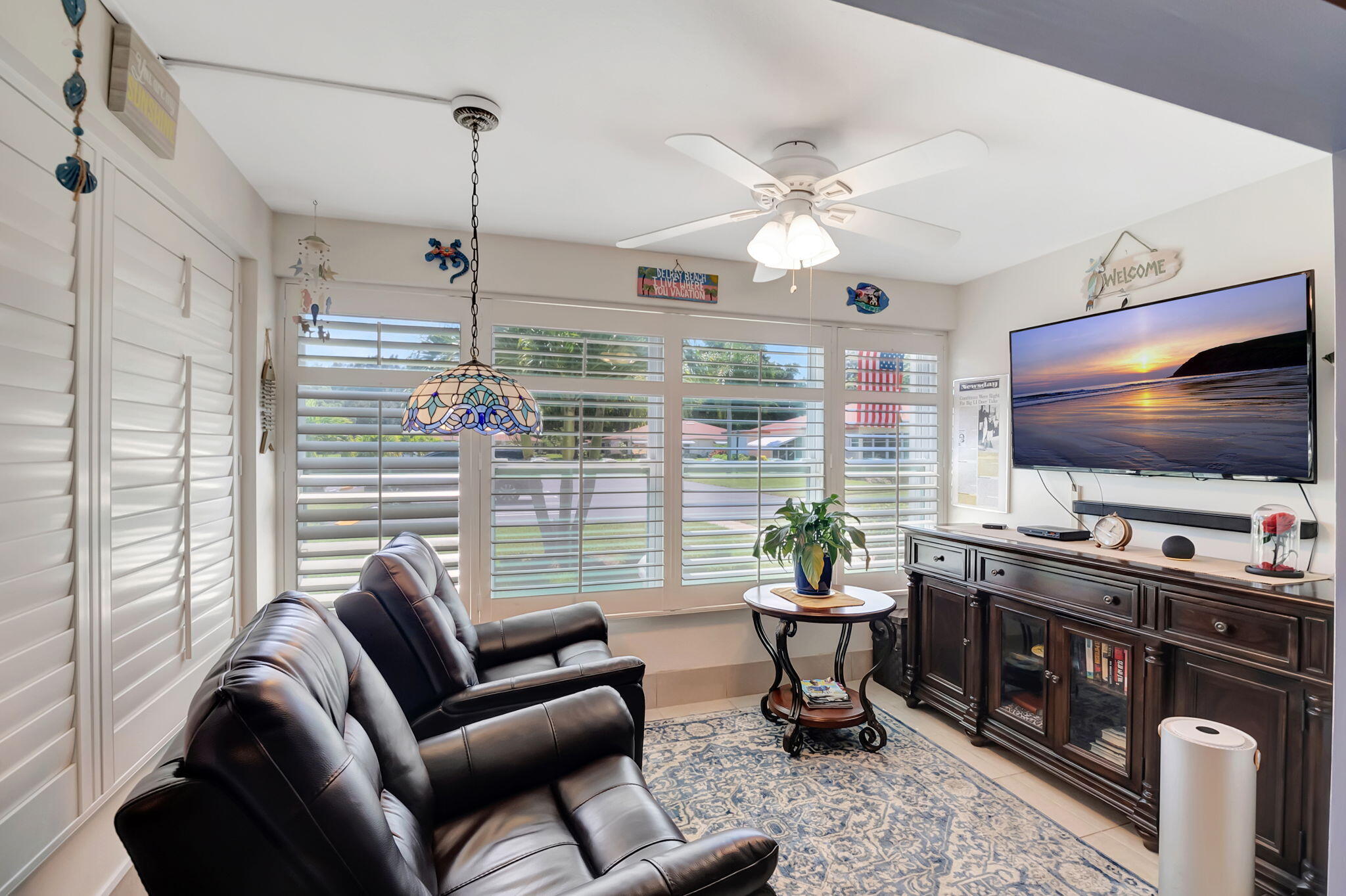 5145 Northwest 3rd Street, Unit B Delray Beach, FL 33445 - Photo 6 of 54 Enclosed Florida room under air (2)