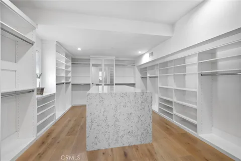 a view of kitchen with furniture and wooden floor