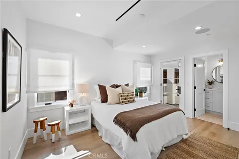 a bedroom with a large bed and a view of bedroom