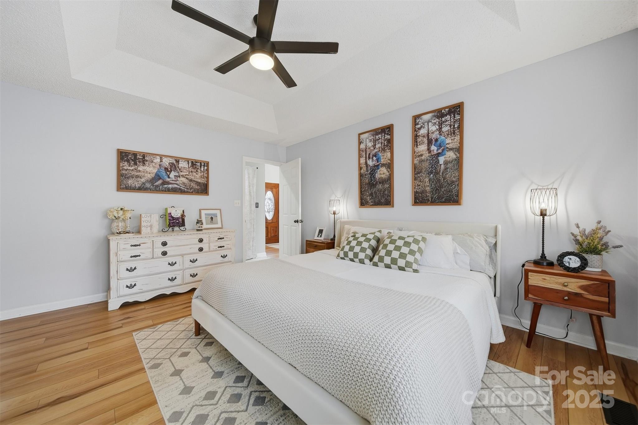 4687 Ransom Drive Conover, NC 28613 - Photo 16 of 27 a bedroom with a bed and wooden floor