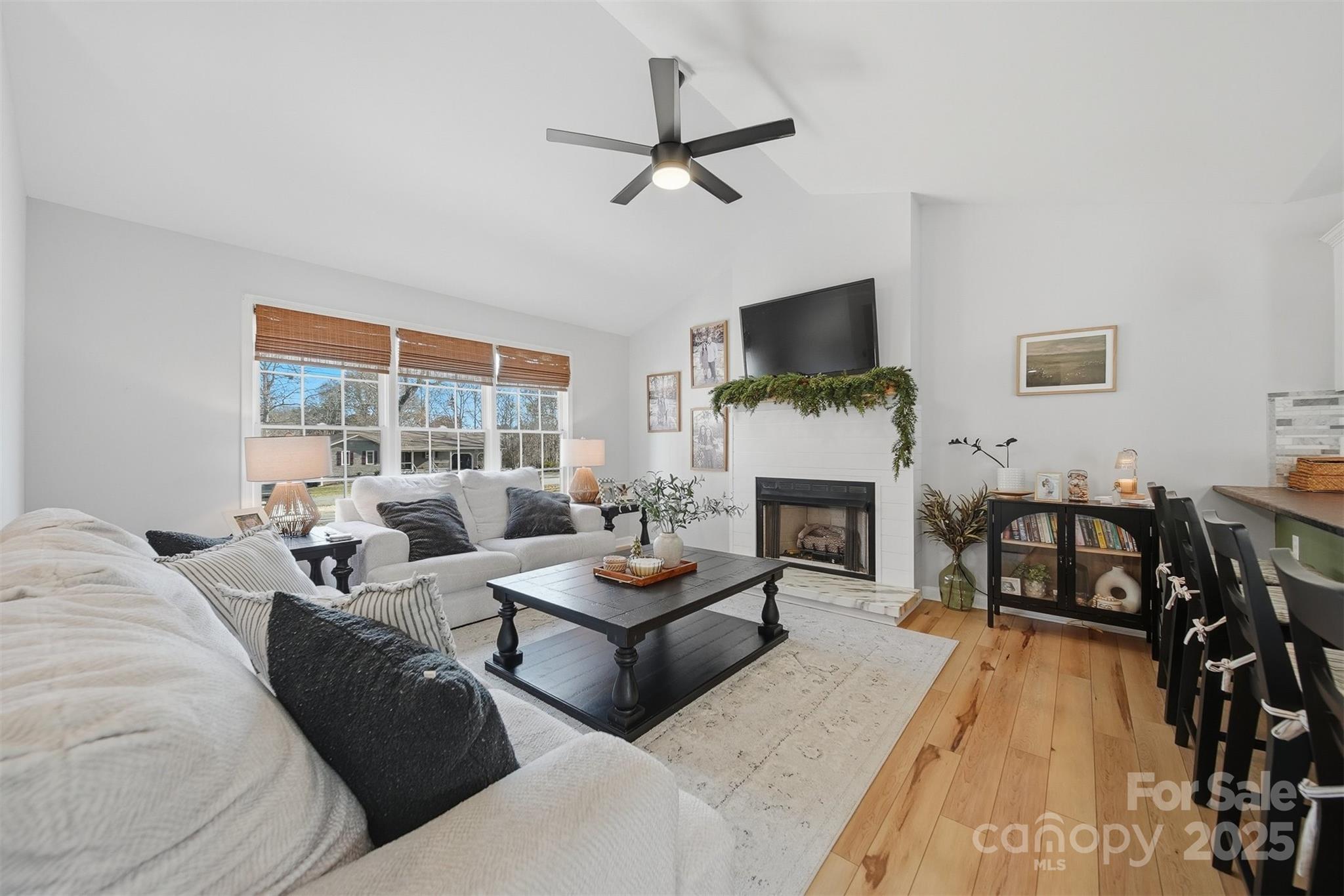 4687 Ransom Drive Conover, NC 28613 - Photo 2 of 27 a living room with furniture fireplace and a flat screen tv