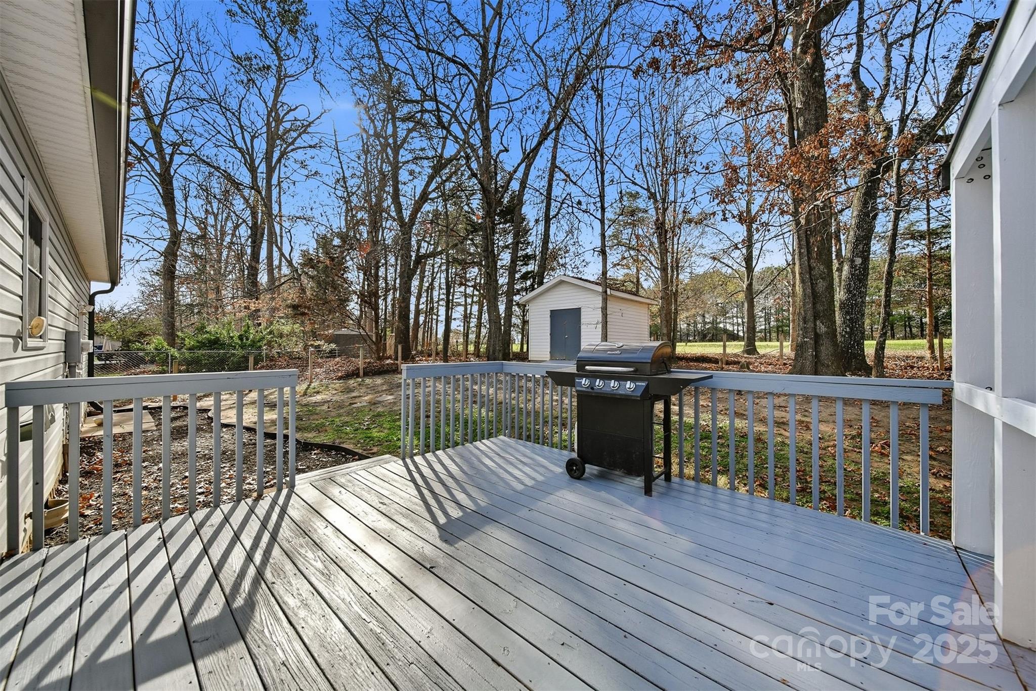 4687 Ransom Drive Conover, NC 28613 - Photo 22 of 27 a view of a deck with chairs and wooden floor