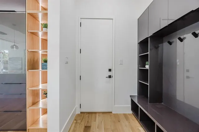 a kitchen with stainless steel appliances kitchen island a sink a refrigerator and window