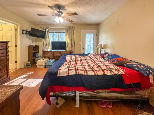 a bedroom with a bed and a fireplace