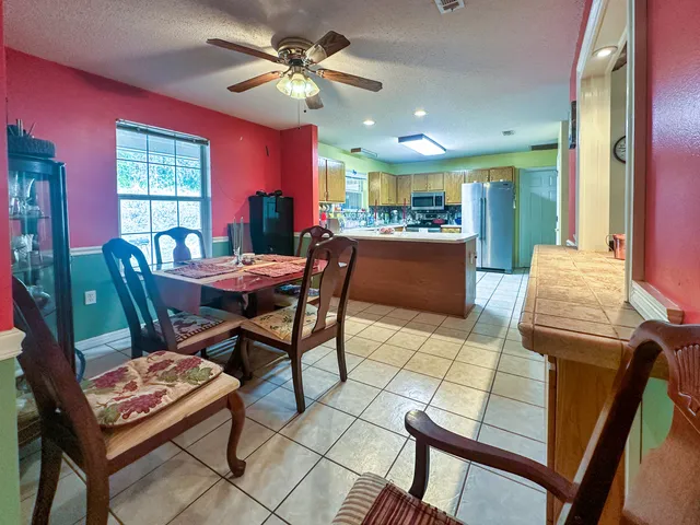 a dining room with furniture and window