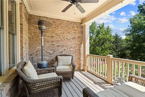 a view of a balcony with furniture