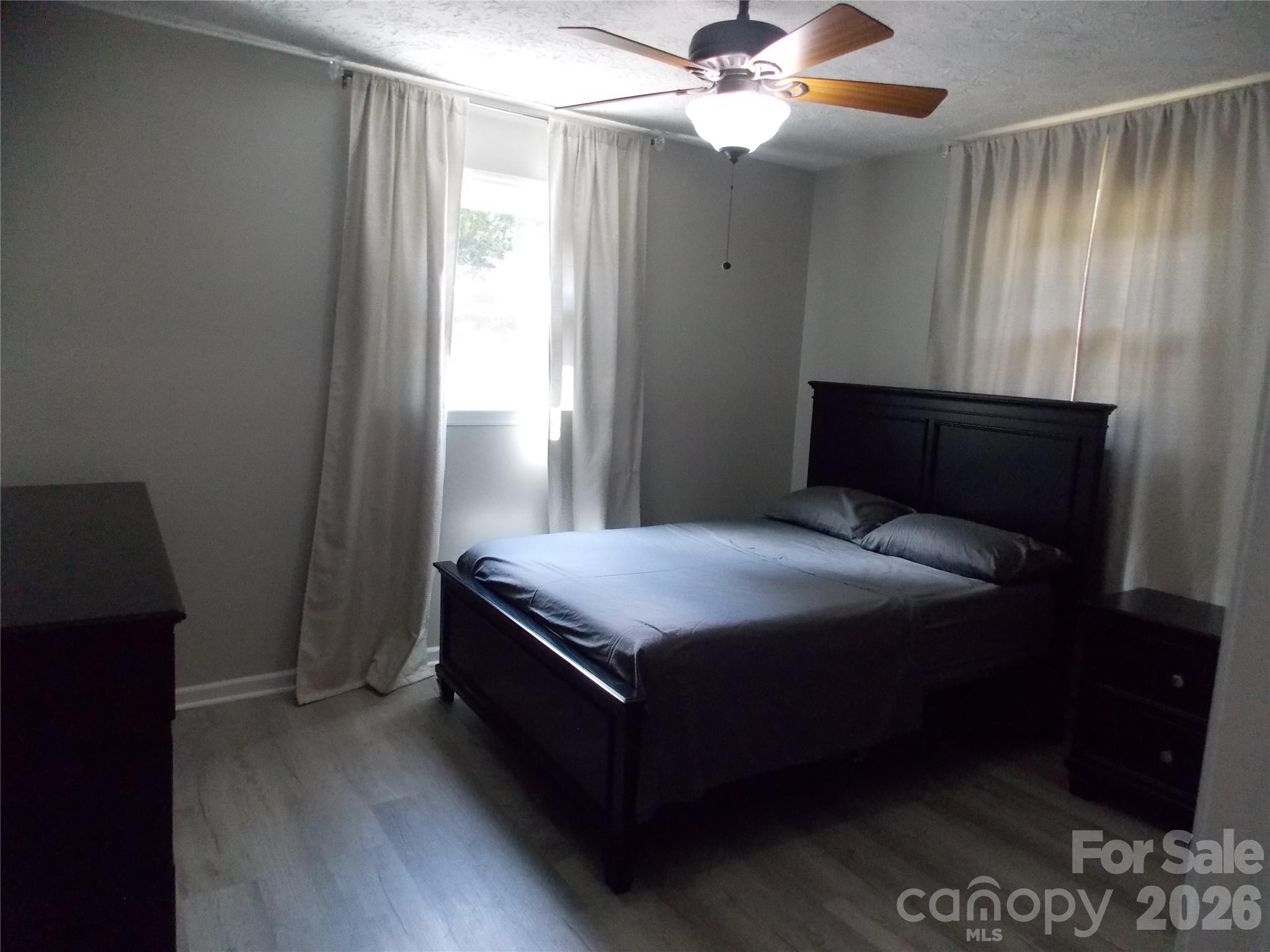 1380 May Road Granite Falls, NC 28630 - Photo 13 of 26 a bedroom with a bed and a window