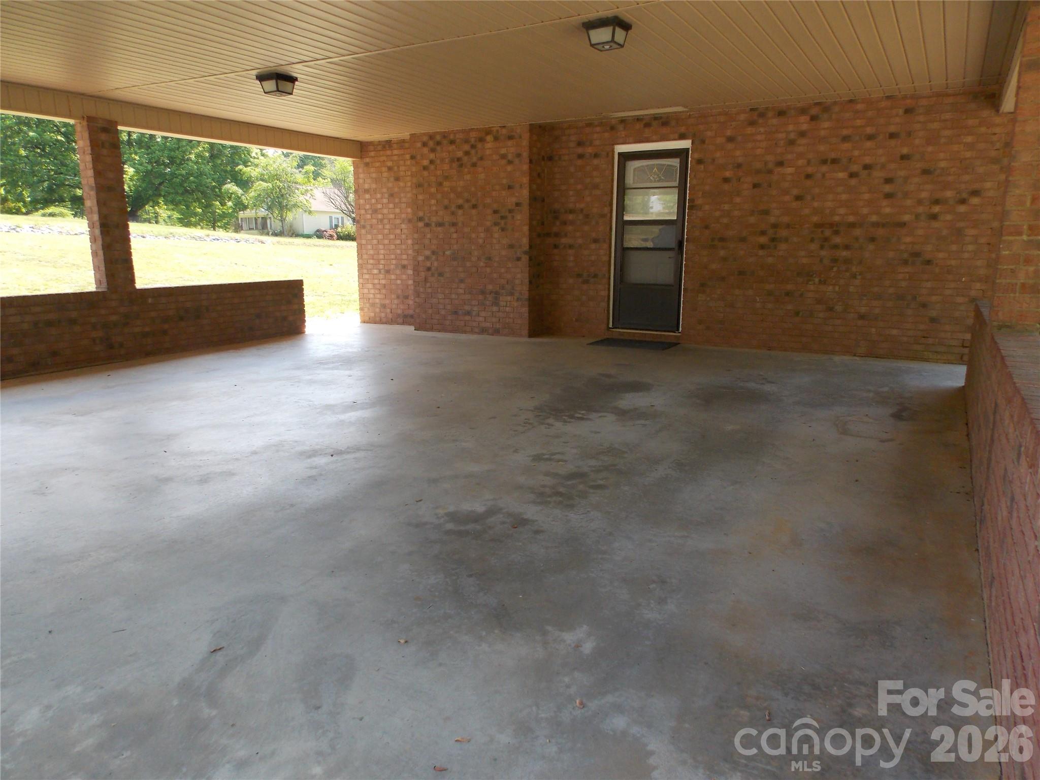 1380 May Road Granite Falls, NC 28630 - Photo 23 of 26 wooden floor in an empty room with a window