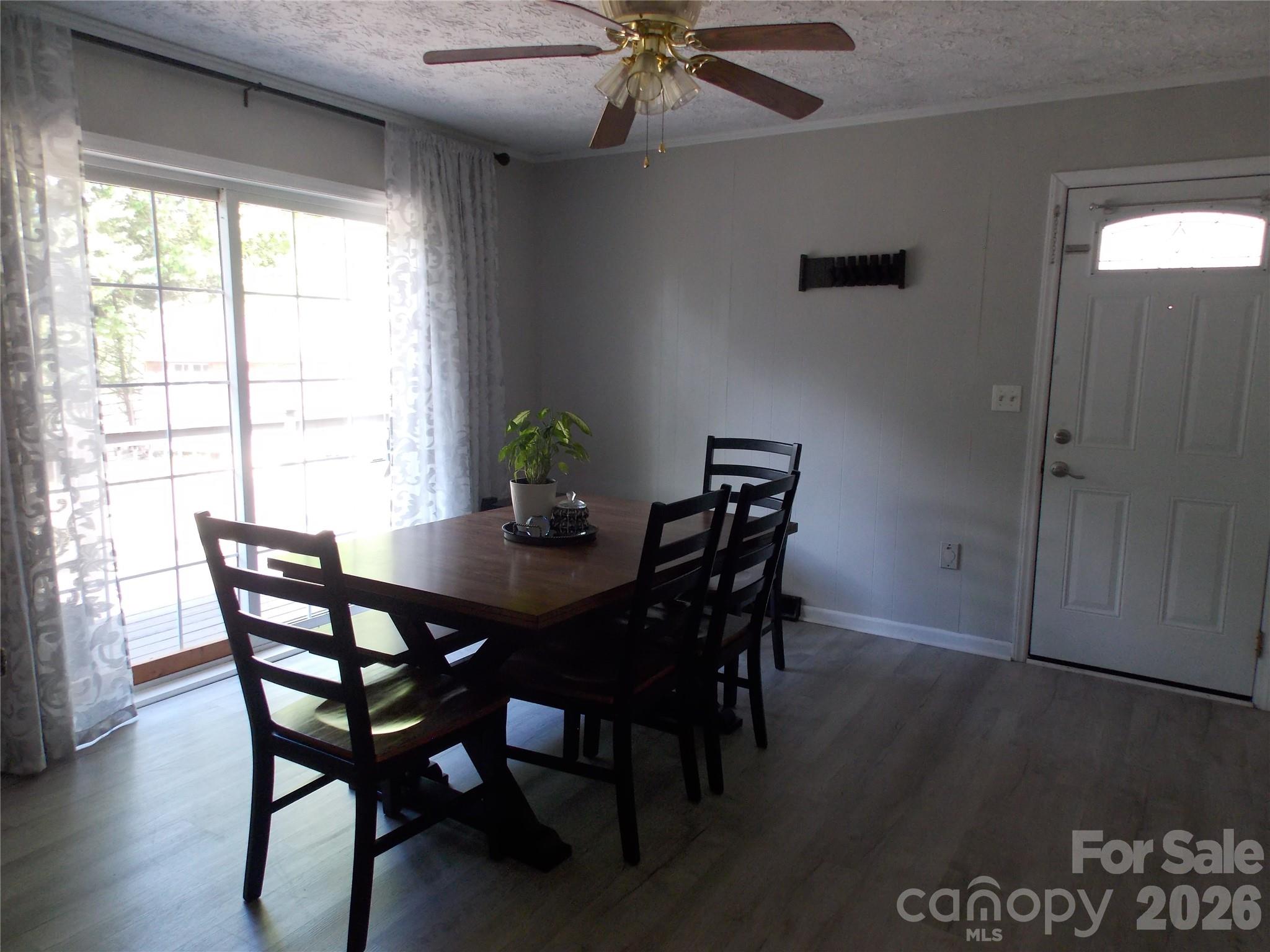 1380 May Road Granite Falls, NC 28630 - Photo 5 of 26 a view of a dining room with furniture and wooden floor