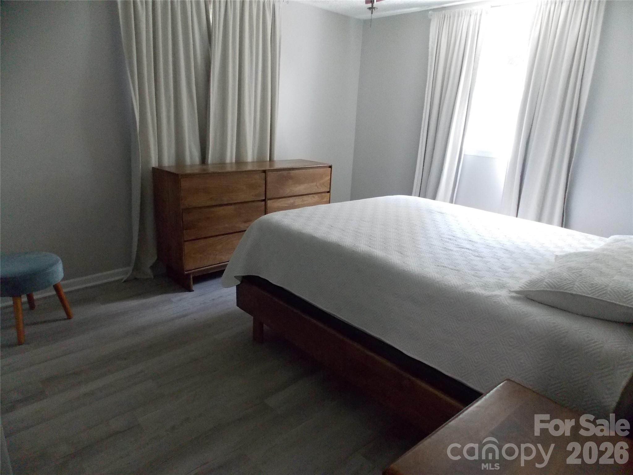1380 May Road Granite Falls, NC 28630 - Photo 10 of 26 a bedroom with a bed and a chair