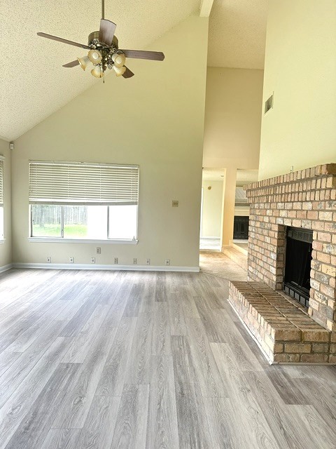 14702 Rancho Vista Drive Houston, TX 77083 - Photo 2 of 18 a view of empty room with a fireplace and wooden floor