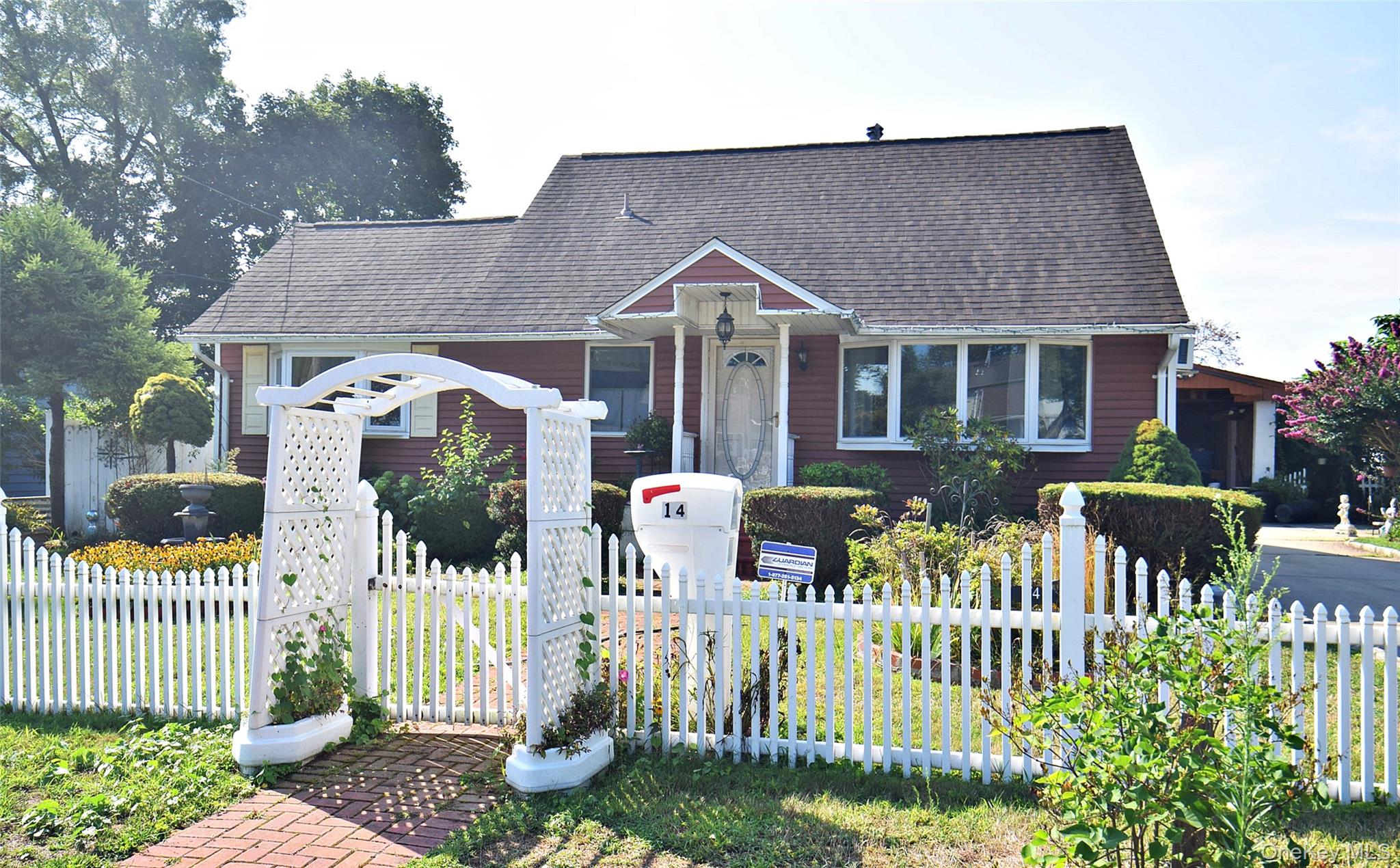 14 East Walnut Street Central Islip, NY 11722 - Photo 18 of 18 a front view of house with patio and garden