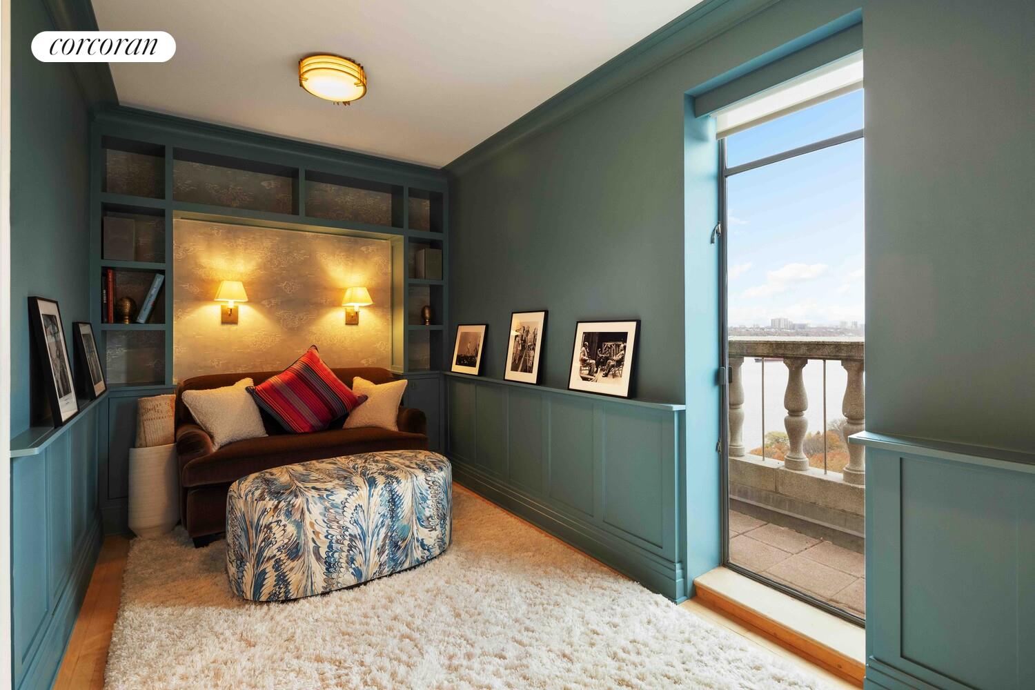 140 Riverside Drive, Unit 19HO Manhattan, NY 10024 - Photo 20 of 35 a living room with furniture and a flat screen tv