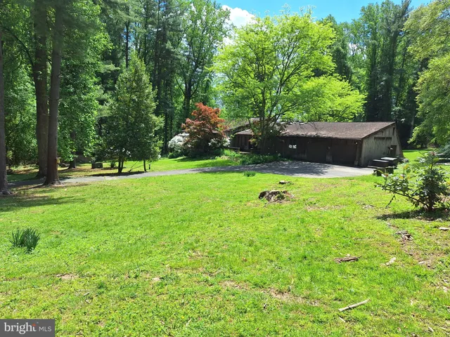 front view of a house with a backyard