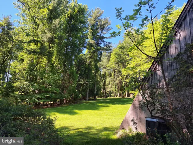 a view of yard with swimming pool