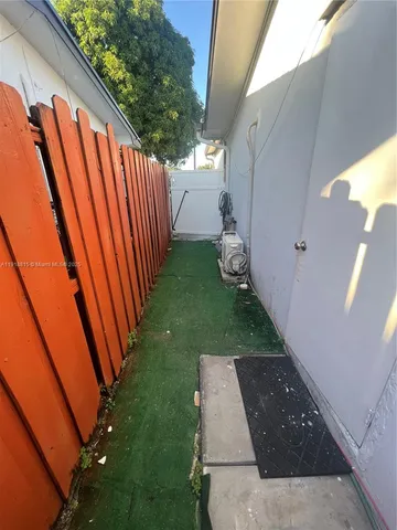 a view of backyard with patio