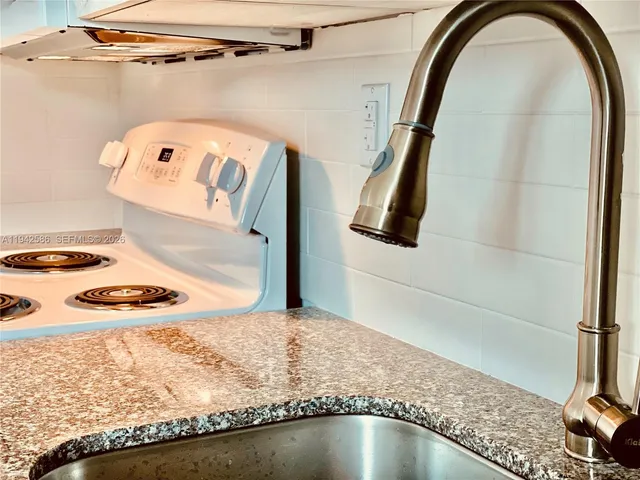 a bathroom with a sink and mirror