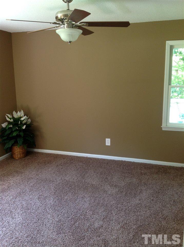 7113 Tyndall Court Raleigh, NC 27615 - Photo 10 of 13 Master Bedroom with half bath area - 2 windows - updated fan/light and carpeting