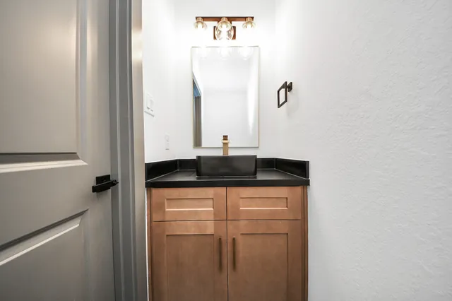 a close view of a sink and mirror