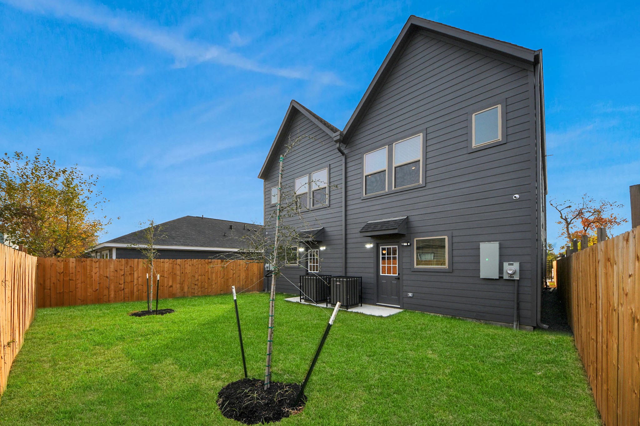 7925 Ritz Street, Unit A Houston, TX 77028 - Photo 35 of 35 a front view of a house with a yard and green space