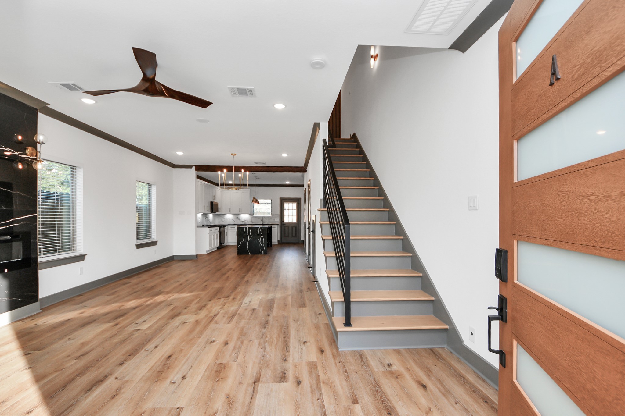 7925 Ritz Street, Unit A Houston, TX 77028 - Photo 4 of 35 a view of entryway and hall with wooden floor